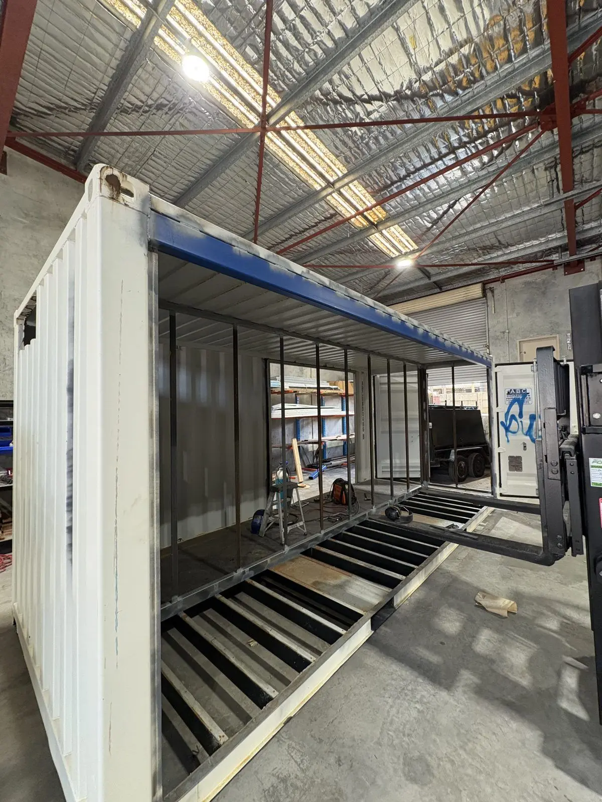 Shipping container being fitted out in the workshop